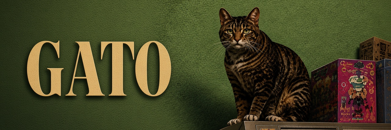 GATO in gold lettering beside a tabby cat seated on a cabinet